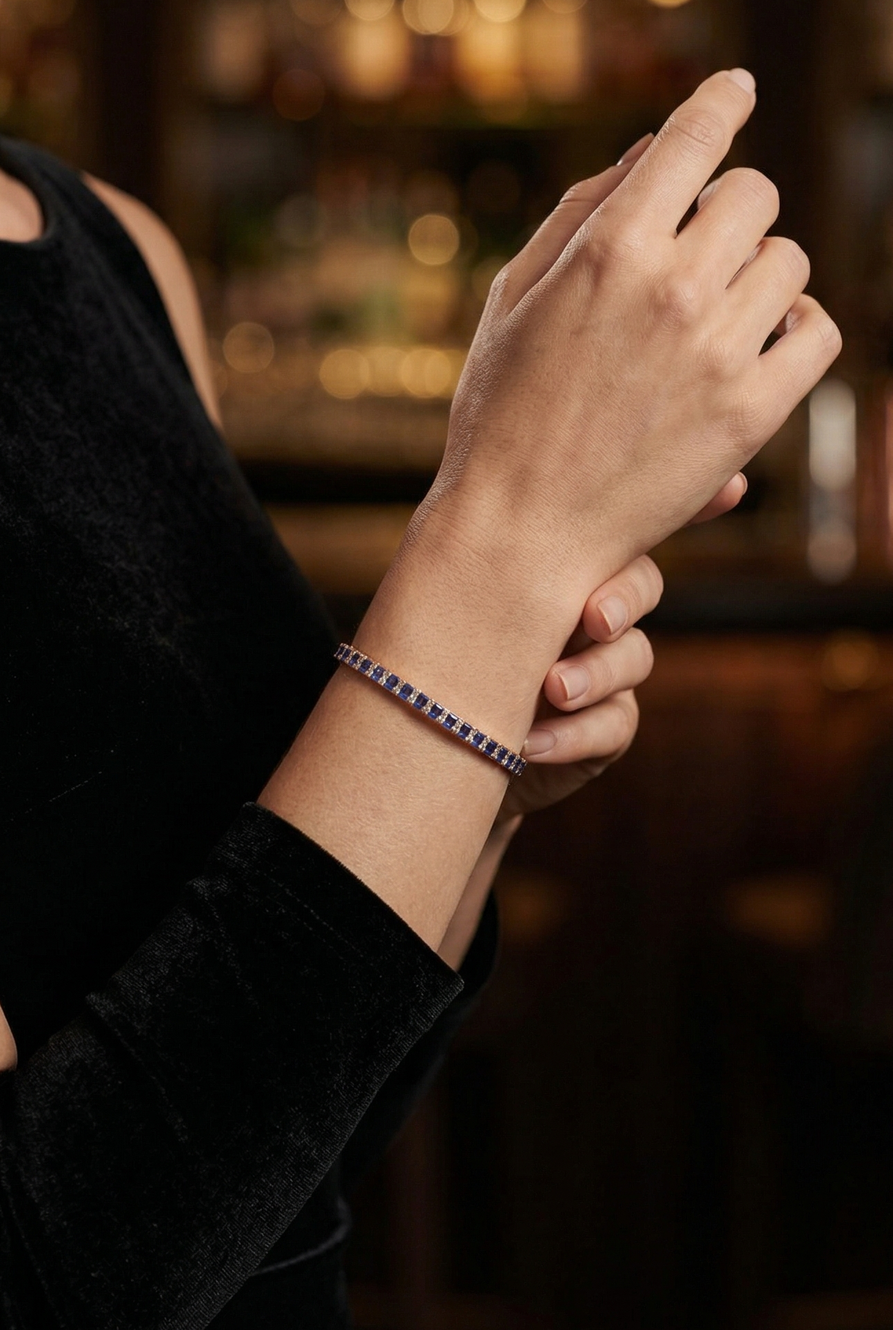Person wearing a bracelet with a blurred bar background
